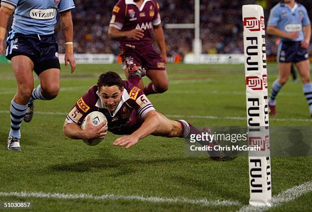 Billy Slater of the Maroons dives over for a try during game three of the NRL State Of Origin series between the New South Wales Blues and the...