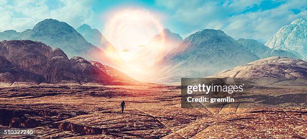 astronaut walking on alien planet, ufo portal - space war stock pictures, royalty-free photos & images