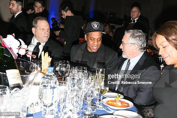 Producer Harvey Weinstein, rapper Jay Z, actor Robert De Niro, and actress Grace Hightower attend the amFAR New York Gala at Cipriani Wall Street in...