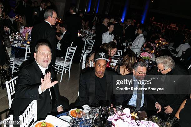 Producer Harvey Weinstein, rapper Jay Z, actor Harvey Keitel, and actor Robert De Niro attend the amFAR New York Gala at Cipriani Wall Street in New...
