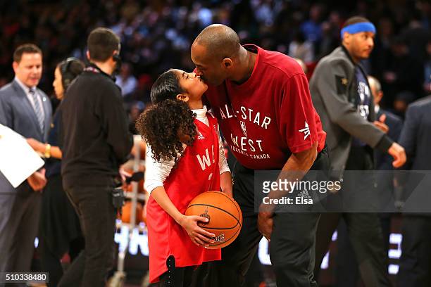 Kobe Bryant of the Los Angeles Lakers and the Western Conference kisses daughter Gianna Bryant during the NBA All-Star Game 2016 at the Air Canada...