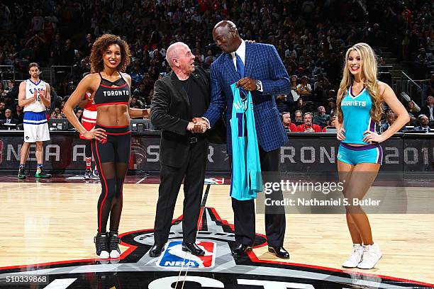 Larry Tanenbaum, Chairman of Maple Leaf Sports & Entertainment, presents NBA Hall of Famer and Charlotte Hornets owner Michael Jordan a jersey...