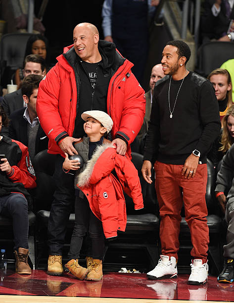 Actor Vin Diesel, son Vincent Sinclair and Ludacris attend the 2016 NBA All-Star Game at Air Canada Centre on February 14, 2016 in Toronto, Canada.