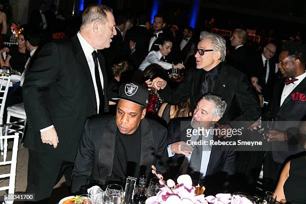 Producer Harvey Weinstein, rapper Jay Z, actor Robert De Niro, and actor Harvey Keitel attend the amFAR New York Gala at Cipriani Wall Street in New...
