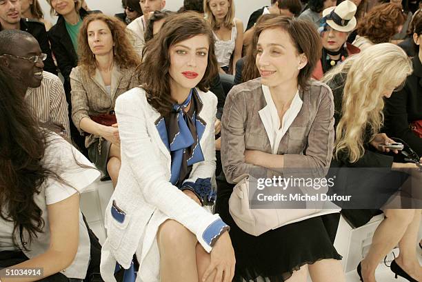 Anna Mouglalis with Kirstin Scott Thomas attend the Chanel Spring/Summer 2005 Fashion Show during Paris Fashion Week on July 7, 2004 in Paris, France.