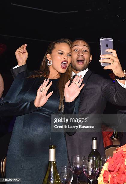 Model Chrissy Teigen and musician John Legend take a selfie at the 2016 Pre-GRAMMY Gala and Salute to Industry Icons honoring Irving Azoff at The...
