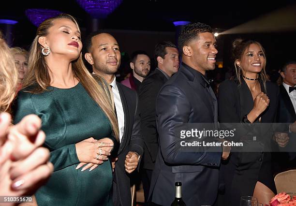 Model Chrissy Teigen, recording artist John Legend, NFL player Russell Wilson, and recording artist Ciara attend the 2016 Pre-GRAMMY Gala and Salute...