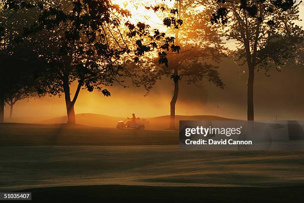 The early morning sun filters through the trees beside the 7th green on the South Course at the Oakland Hills CC venue for the 2004 Ryder Cup...