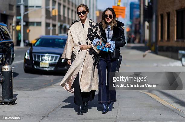 Dani Song is wearing a gold La Boutique butterfly coat and Aimee Song seen outside Rebecca Minkoff during New York Fashion Week: Women's Fall/Winter...