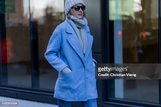 Guest wearing an azure blue wool coat seen outside Tibi during New York Fashion Week: Women's Fall/Winter 2016 on February 13, 2016 in New York City.
