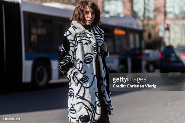 Guest wearing a white black fake fur coat seen outside Tibi during New York Fashion Week: Women's Fall/Winter 2016 on February 13, 2016 in New York...