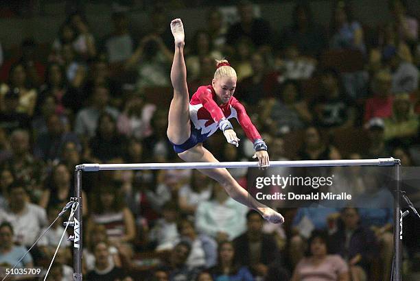 Courtney McCool competes on the uneven bars during the Women's preliminaries of the U.S. Gymnastics Olympic Team Trials on June 25, 2004 at The...