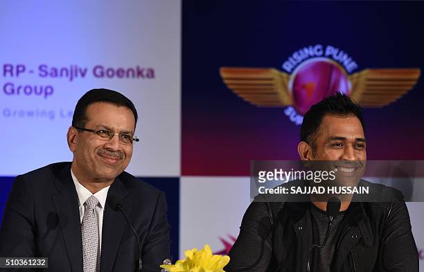 Industrialist and owner of the Indian Premier League's Rising Pune Supergiants cricket team Sanjiv Goenka and team captain Mahendra Singh Dhoni speak...