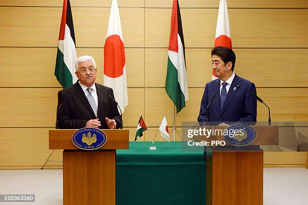 In this handout image supplied by the Palesinian President's Office , Palestinian president Mahmoud Abbas attends a press conference with Japanese...