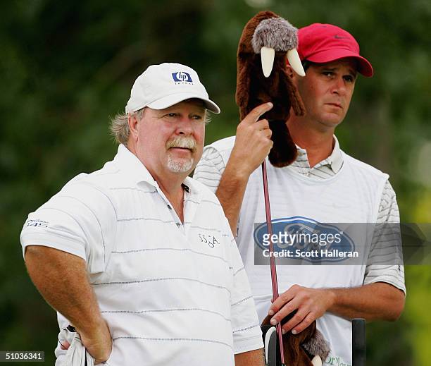 Craig Stadler waits with his caddie Jeff Dolf on the second tee during the first round of the Ford Senior Players Championship at the TPC of Michigan...