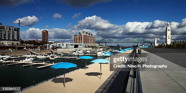 urban beach in old port - montreal - clock tower beach canada stock pictures, royalty-free photos & images