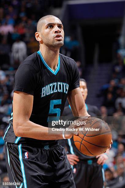 Nicolas Batum of the Charlotte Hornets attempts a free throw shot against the Miami Heat on Februay 5, 2016 at Time Warner Cable Arena in Charlotte,...