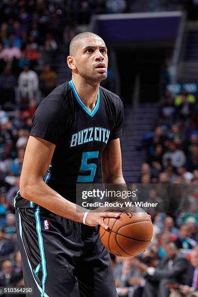 Nicolas Batum of the Charlotte Hornets attempts a free throw shot against the Miami Heat on February 5, 2016 at Time Warner Cable Arena in Charlotte,...