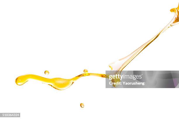 active oil splash in white background - olive oil splash stock pictures, royalty-free photos & images