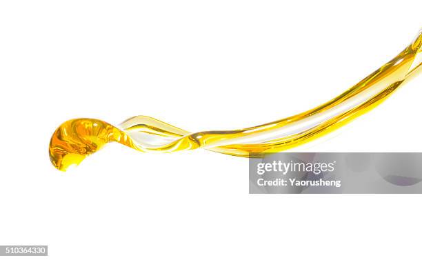 active oil splash in white background - oil flow imagens e fotografias de stock