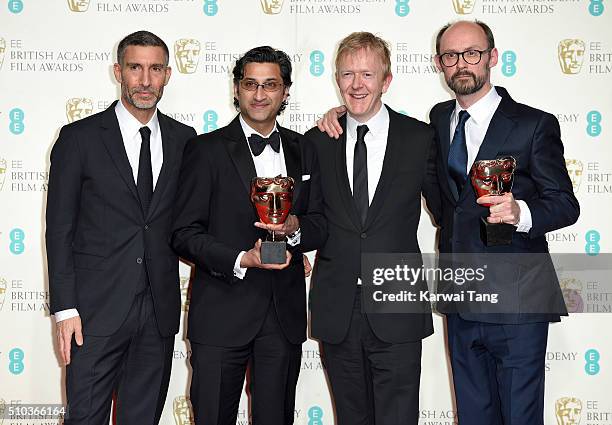 David Joseph and Chris King pose with winners of Best Documentary for 'Amy', Asif Kapadia and and James Gay-Rees in the winners room at the EE...