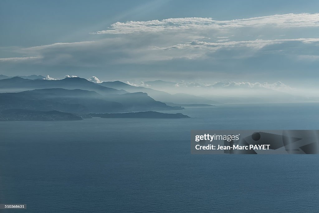 Aerial view of seascape, coast and mist