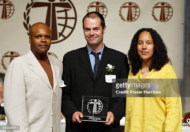 Writer Jacob Aaron Estes, receives his award from Reggie Rock Bythewood and Gina Prince Bytewood at The Humanitas Prize Awards at the Universal...