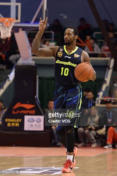 Justin Carter of Guangdong Southern Tigers drives the ball during the Chinese Basketball Association 15/16 season play-off quarter-final match...