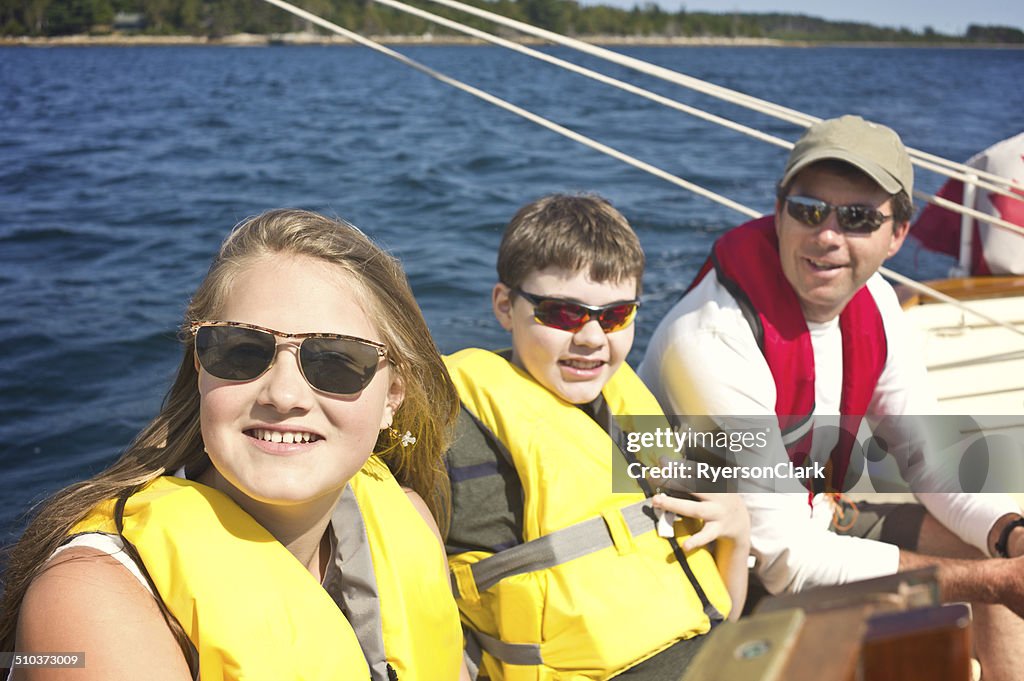 Father and Teenage Children Sailing on Mahone Bay, Nova Scotia