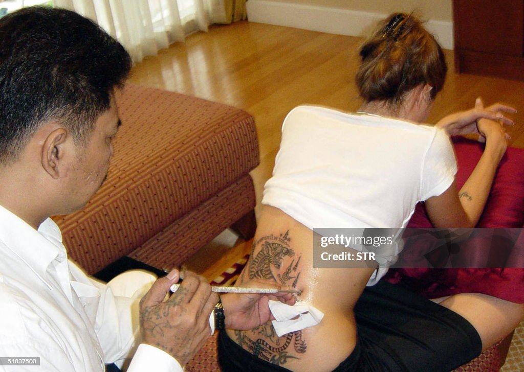 Hollywood superstar Angelina Jolie (R) g