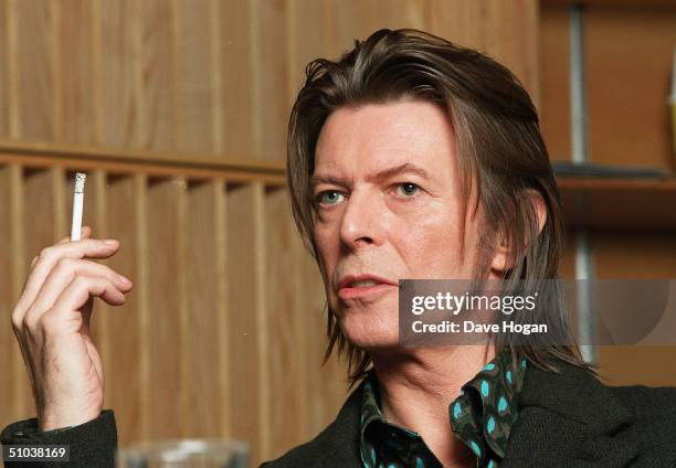 Musician David Bowie appears during a live radio interview with Radio One DJ's Mark and Lard at the Radio One Maida Vale studio on in 2001 in London....