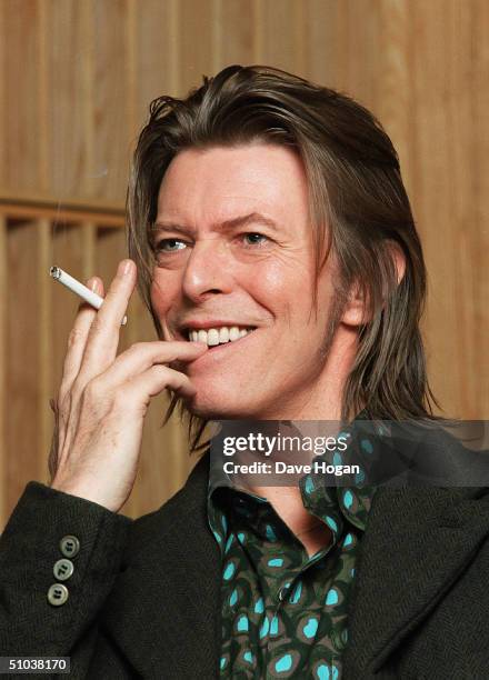 Musician David Bowie appears during a live radio interview with Radio One DJ's Mark and Lard at the Radio One Maida Vale studio on in 2001 in London....