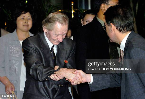 Charles Robert Jenkins an alleged US army deserter, is greeted by the hotel manager after he arrived at the hotel with his Japanese wife Hitomi Soga...