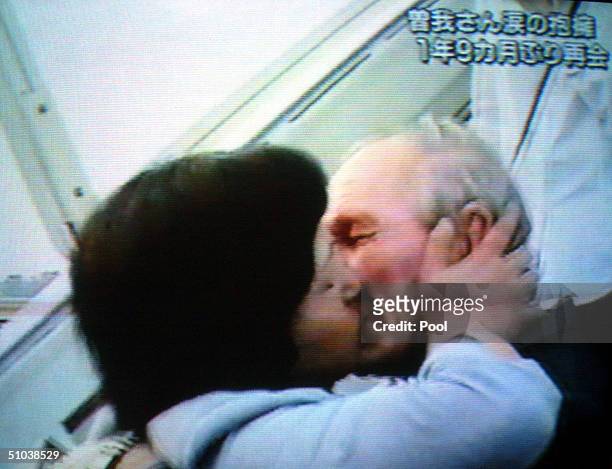 Seen in this frab grab, Former U.S soldier Charles Jenkins embraces his wife Hitomi Soga, a Japanese citizen who was abducted by North Korean agents...