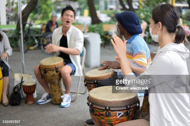 drum circle - african drum stock pictures, royalty-free photos & images