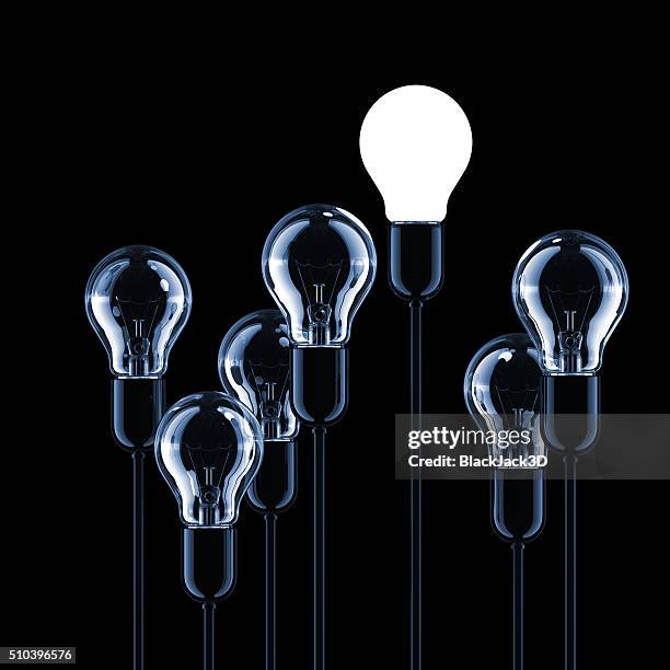 light bulbs concept - smart leaders stock pictures, royalty-free photos & images