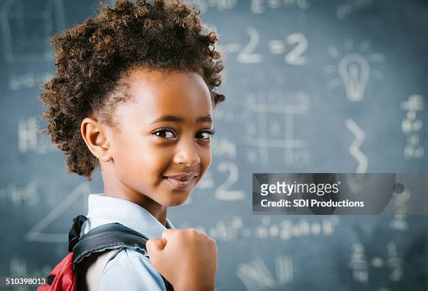 cute little african school girl in classroom - mathematical symbol stock pictures, royalty-free photos & images