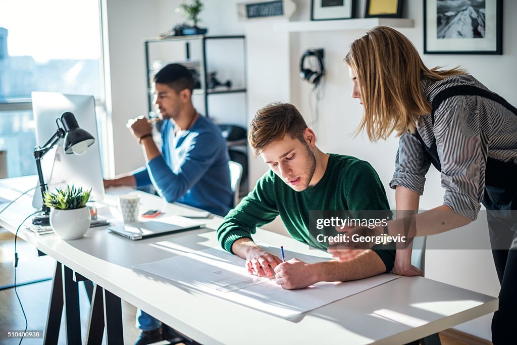 Helping A Coworker High-Res Stock Photo - Getty Images
