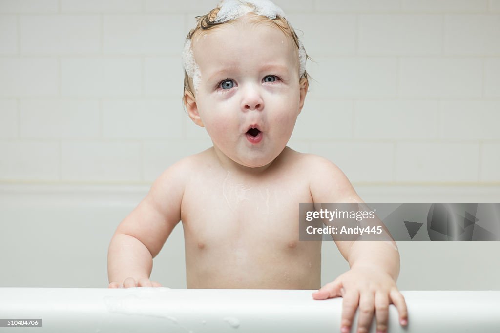 Playful baby in the tub