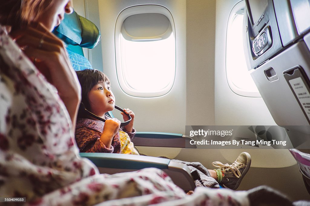 Mom & child riding on the airplane