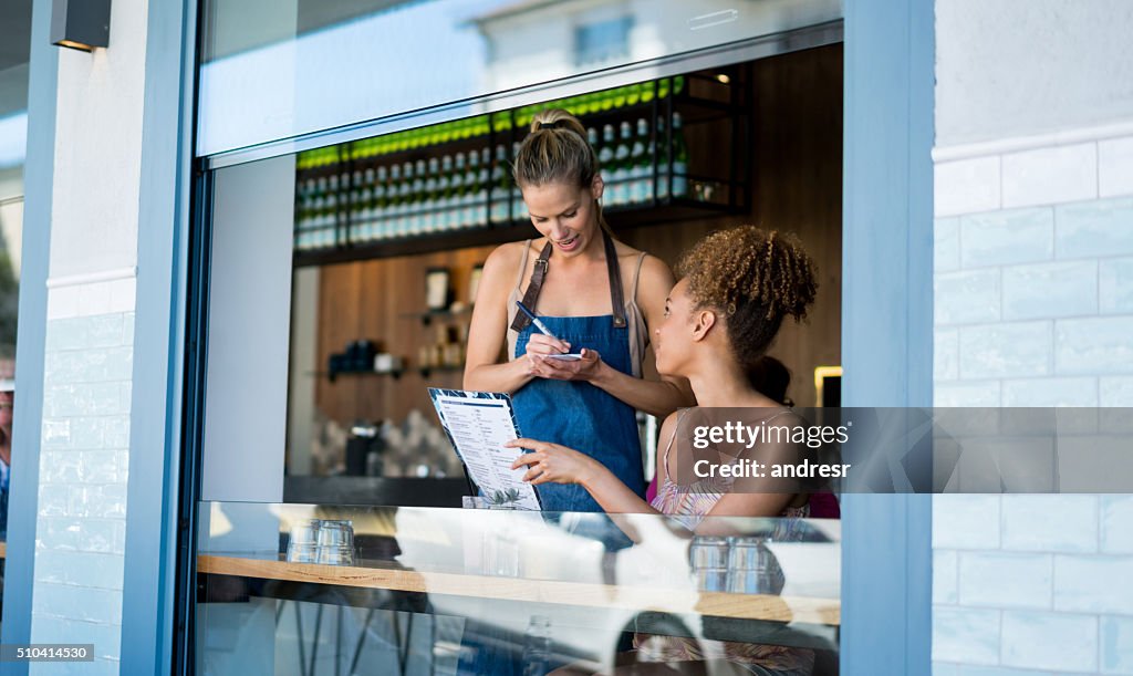 Waitress taking orders at a restaurant
