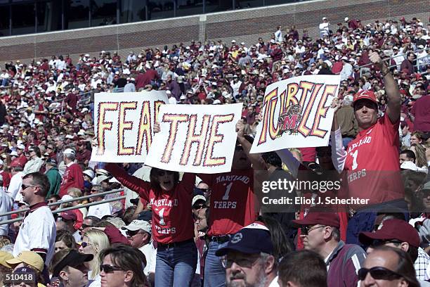 Maryland fans hold up signs to support their team against Florida State during the game at Doak Campbell Stadium in Tallahassee, Florida. Florida...