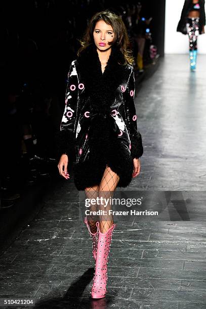 Model walks the runway wearing Jeremy Scott Fall 2016 during New York Fashion Week: The Shows at The Arc, Skylight at Moynihan Station on February...