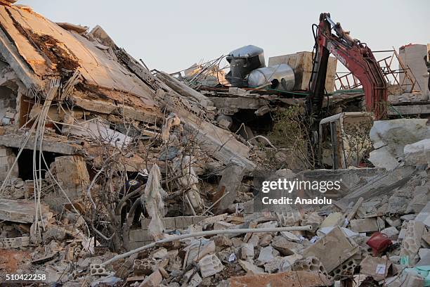 Rescue workers inspect the debris of a collapsed hospital, belongs to humanitarian aid organization "Doctors Without Borders" to save victims after...