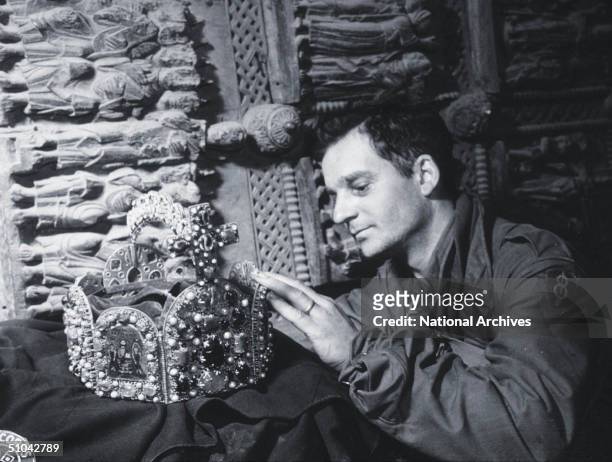 Us Soldier Inspects A Priceless Treasure Taken From Jews By The Nazi's And Stashed In The Heilbronn Salt Mines May 3, 1945 In Germany.