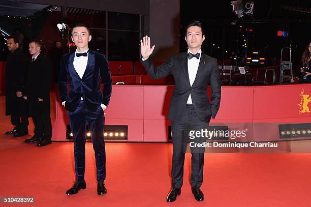 Actors Wu Lipeng and Tan Kai attend the 'Crosscurrent' premiere during the 66th Berlinale International Film Festival Berlin at Berlinale Palace on...