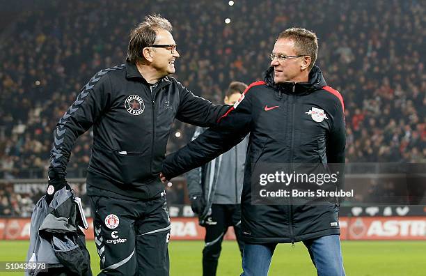 Head coach Ralf Rangnick of Leipzig and head coach Ewald Lienen of St. Pauli hug prior to the Second Bundesliga match between FC St. Pauli and RB...