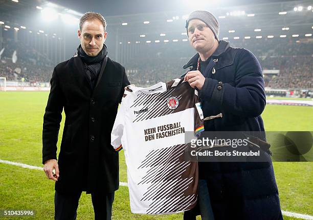 Oke Goettlich , president of St. Pauli and marketing director of Leipzig Oliver Minzlaff presents a special jersey against racism prior to the Second...