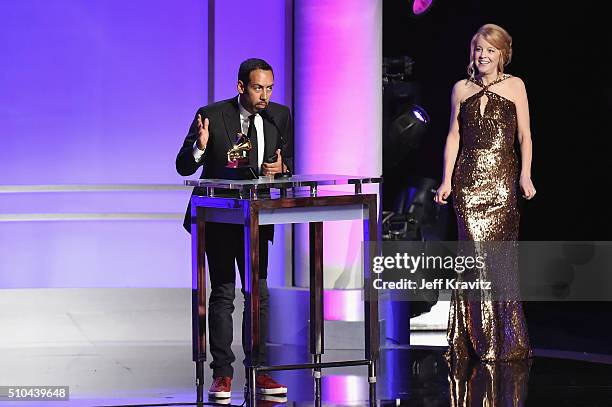 Musician/composer Antonio Sanchez accepts the award for Best Score Soundtrack for Visual Media for 'Birdman' alongside composer Maria Schneider...