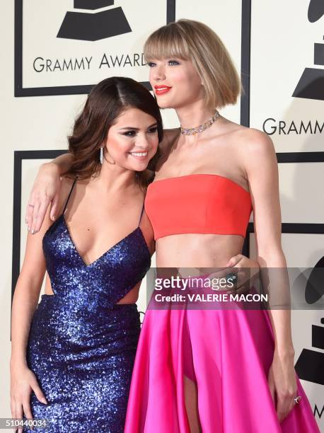 Singer Taylor Swift and Selena Gomez arrive on the red carpet for the 58th Annual Grammy music Awards in Los Angeles February 15, 2016. AFP PHOTO/...